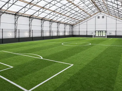 An indoor football pitch inside a clear span building