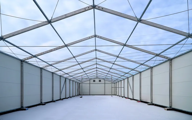 Empty interior of a temporary building with a translucent roof