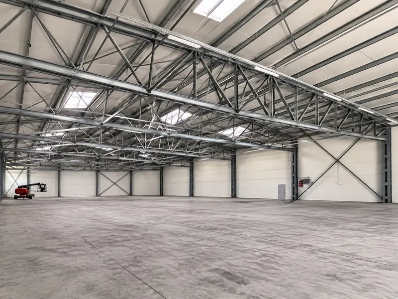 A white steel-framed temporary building with a PVC roof