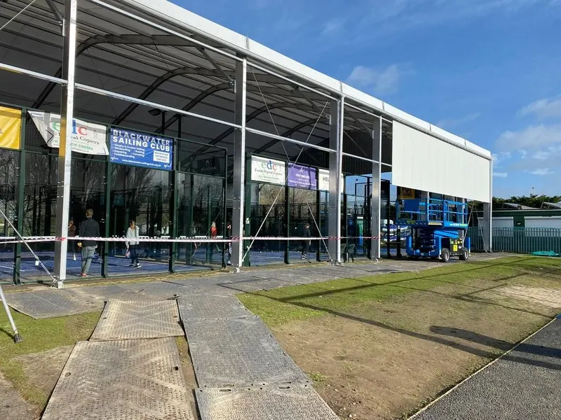 A white steel-framed temporary building with a PVC roof