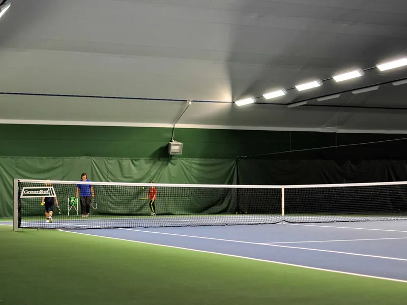 Covered court inside a clear span sports building